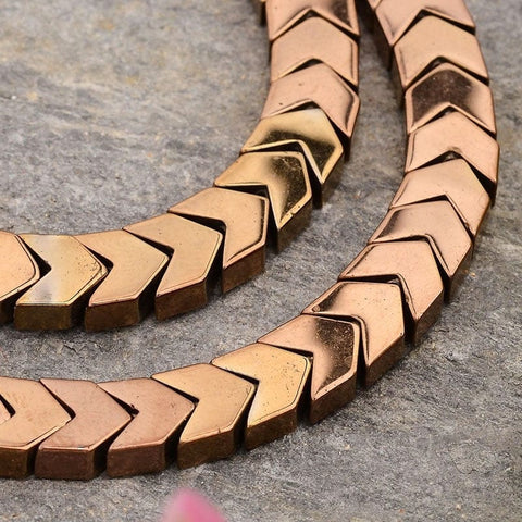 BeadsBalzar Beads & Crafts (HB6085C) Electroplated Arrows  Hematite, Copper Plated Size: about 7mm wide, 6mm long, 3mm thick