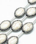 (BG5216D) Natural Howlite Rhinestone Beads, Oval, Ivory Natural Howlite Rhinestone Beads, Oval, Ivory Size: about 20.5~23mm long, 6mm thick, hole: 1mm.