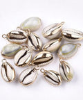 Cowrie Shell Pendants, with Brass Findings, Golden Size: about 18~20mm long Cowrie Shell Pendants, with Brass Findings, Golden Size: about 18~20mm long, 11~13mm wide, 7~8mm thick, hole: 1.5mm
