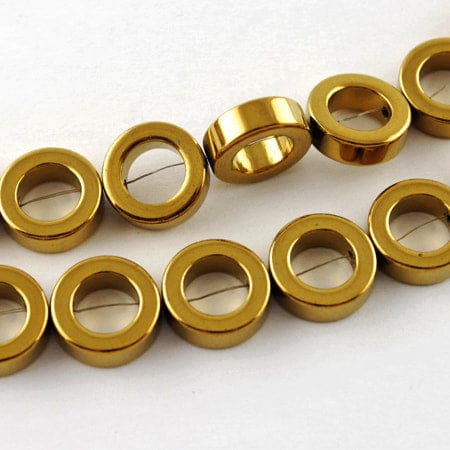 (HB5641) Non-magnetic Synthetic Hematite Beads Strands, Grade A, Donut, Golden Plated 12mm Non-magnetic Synthetic Hematite Beads Strands, Grade A, Donut, Golden Plated Size: about 12mm in diameter, 4mm thick, hole: 1mm; 34pcs/strand, 15.5".