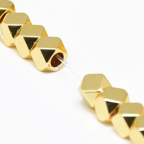 GOLDEN PLATED (HB6080C) (HB6080-X) Hematite Strands, Polygon, 4mm Hole: 2mm (1 STR) Electroplate Synthetic Non-magnetic Hematite Beads Strands, Polygon, Golden Plated Size: about 4mm long, 4mm wide, 4mm thick, hole: 2mm; about 97pcs/strand, 15.7".