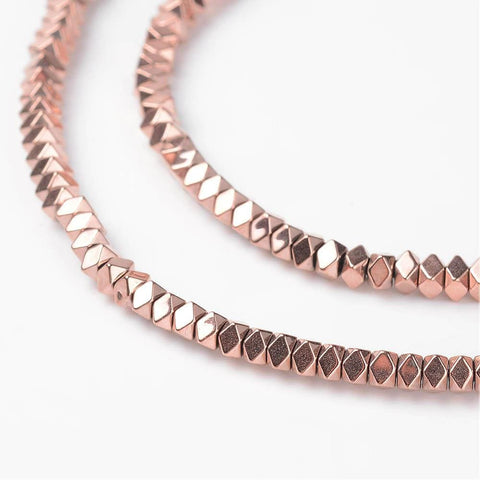 Non-Magnetic Synthetic Hematite Beads Strands, Polygon, Faceted, Rose Gold Plated 3MM Non-Magnetic Synthetic Hematite Beads Strands, Polygon, Faceted, Rose Gold Plated Size: about 3mm wide, 3mm long, 2mm thick, hole: 1mm; about 198pcs/strand, 16.1"