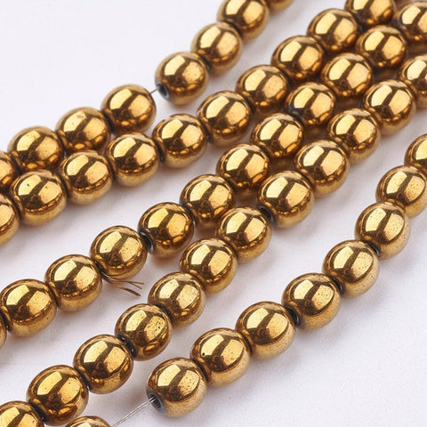 Non-magnetic Synthetic Hematite Strands, Round, Golden Plated 6mm in diameter, hole: 1.5~2mm Non-magnetic Synthetic Hematite Beads Strands, Grade A, Round, Golden Plated Size: about 6mm in diameter, hole: 1.5~2mm; about 65~70pcs/strand.