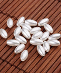 Rice Imitation Pearl Acrylic Beads, White Size: about 4mm wide, 8mm long, hole: 0.5mm Rice Imitation Pearl Acrylic Beads, White Size: about 4mm wide, 8mm long, hole: 0.5mm