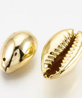 (SH5610) UV Plated Freshwater Shell Pendants, Cowrie Shell, Golden 14~16mm long UV Plated Freshwater Shell Pendants, Cowrie Shell, Golden Size: about 14~16mm long, 8~9mm wide, 6~7mm thick, hole: 1mm.
