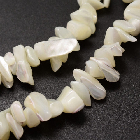 (SH5646) Natural Spiral Shell Beads Strands, Shell Shards, Chip, Ivory Size: about 5~8mm long Natural Spiral Shell Beads Strands, Shell Shards, Chip, Ivory Size: about 5~8mm long, 5~8mm wide, hole: 1mm; 32".